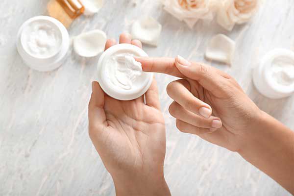 Serum bottles and skincare products arranged on a surface